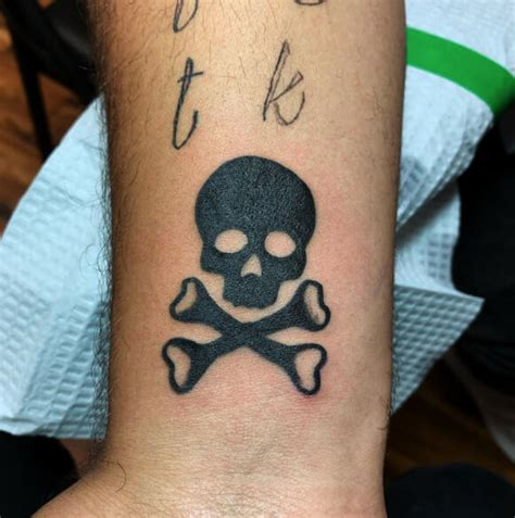 crossbones tattoo|15 Skull and Crossbones Tattoo Designs that Embody Strength and.